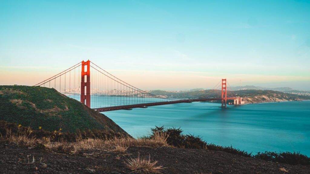Stunning view of the Golden Gate Bridge during sunset overlooking the ocean and shoreline